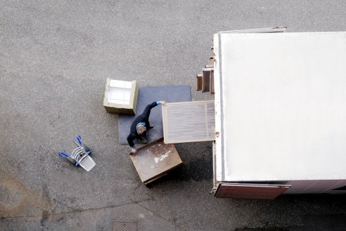 Local removals van loading household items in Manorpark
