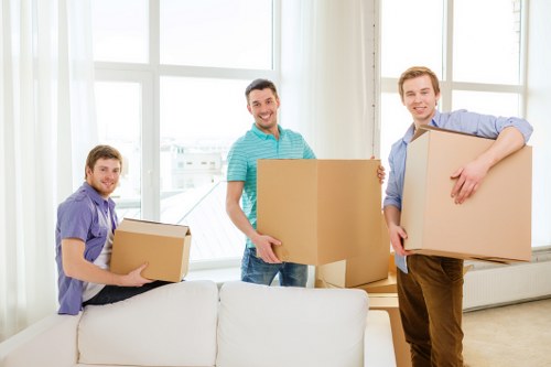 Furniture being carefully transported during a local move in Manorpark